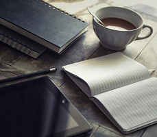 Notebooks, pencil, computer tablet, china cup